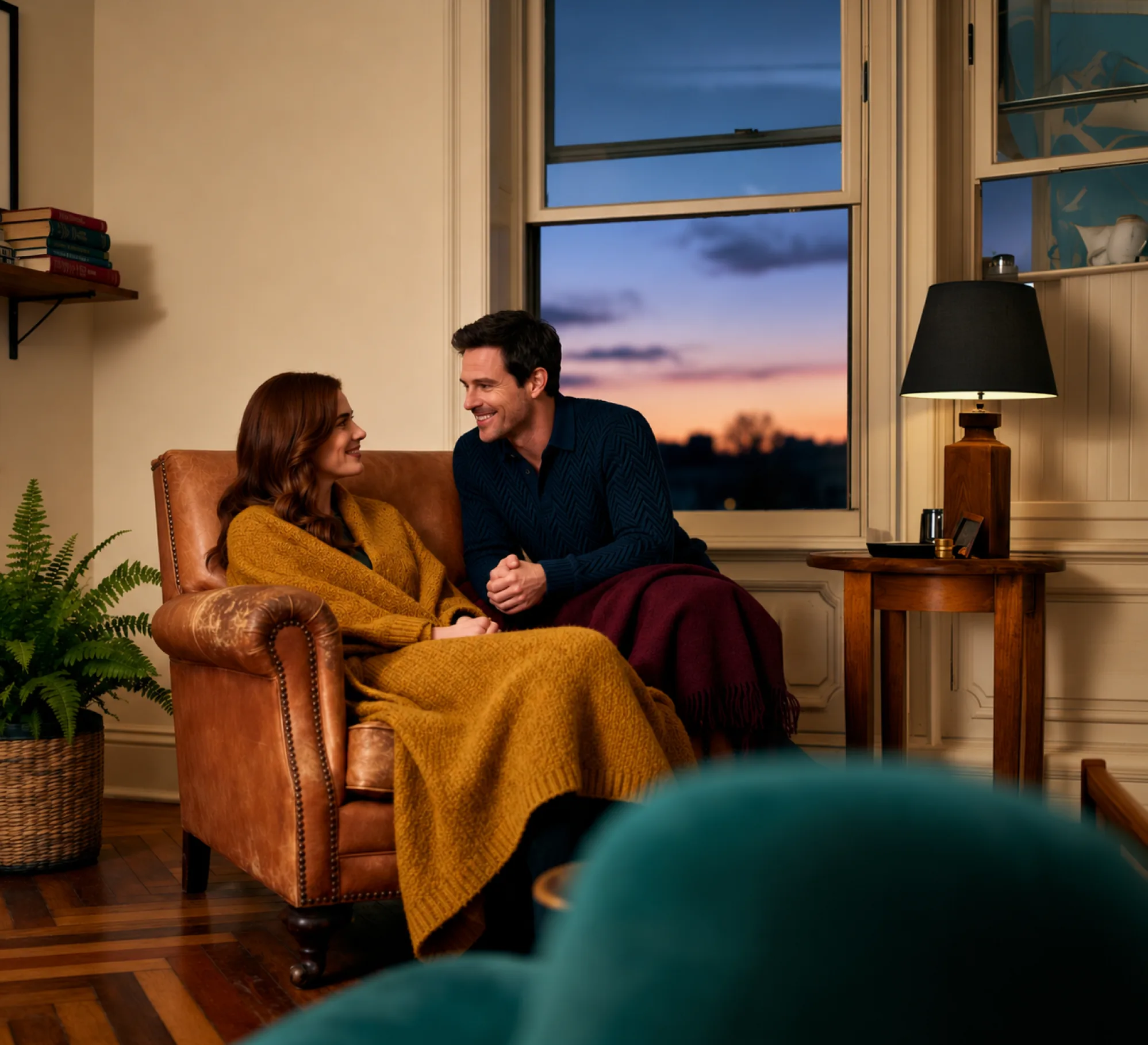 A couple talking on a sofa
